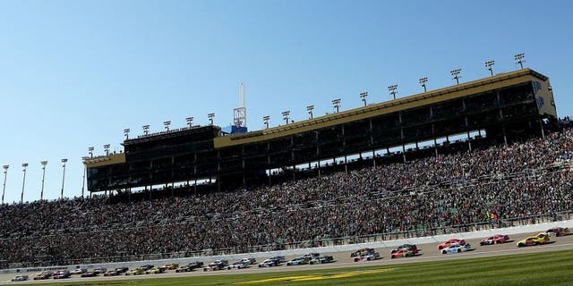 KANSAS CITY, KS - OCTOBER 18: General view as Brad Keselowski, driver of the #2 Miller Lite Ford, leads the field past the green flag to start the NASCAR Sprint Cup Series Hollywood Casino 400 at Kansas Speedway on October 18, 2015 in Kansas City, Kansas. (Photo by Jerry Markland/Getty Images)