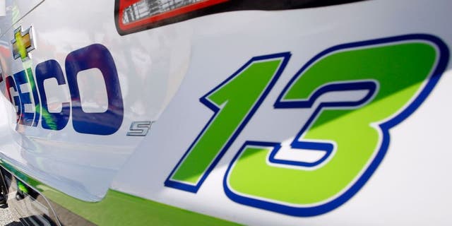 DAYTONA BEACH, FL - FEBRUARY 19: Casey Mears, driver of the #13 GEICO Chevrolet, stands in the garage area with his crew chief, Robert Barker, during practice for the NASCAR Sprint Cup Series Daytona 500 at Daytona International Speedway on February 19, 2016 in Daytona Beach, Florida. (Photo by Brian Lawdermilk/Getty Images)