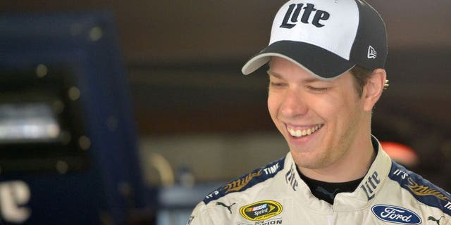 MARTINSVILLE, VA - APRIL 02: Brad Keselowski, driver of the #2 Miller Lite Ford, stands in the garage area during practice for the NASCAR Sprint Cup Series STP 500 at Martinsville Speedway on April 2, 2016 in Martinsville, Virginia. (Photo by Drew Hallowell/Getty Images)