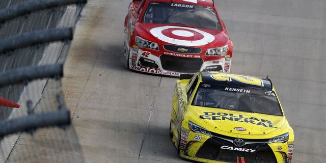 DOVER, DE - MAY 15: Matt Kenseth, driver of the #19 Stanley Toyota, leads Kyle Larson, driver of the #42 Target Chevrolet, during the NASCAR Sprint Cup Series AAA 400 Drive for Autism at Dover International Speedway on May 15, 2016 in Dover, Delaware. (Photo by Patrick Smith/Getty Images)