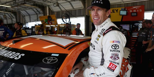 SPARTA, KY - JULY 07: Carl Edwards, driver of the #19 ARRIS Surfboard Toyota, climbs into his car during practice for the NASCAR Sprint Cup Series Quaker State 400 at Kentucky Speedway on July 7, 2016 in Sparta, Kentucky. (Photo by Dylan Buell/Getty Images)