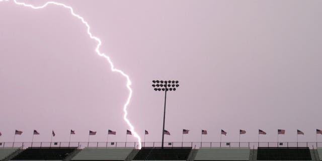 MADISON, IL - JULY 29: Lightning hits behind the front stretch grandstands during a thunderstorm before the start of the NASCAR Busch Series Busch Silver Celebration 250 presented by Shop 'n Save on July 29, 2006 at the Gateway International Raceway in Madison, Illinois. (Photo by Robert Laberge/Getty Images for NASCAR)