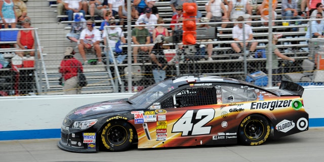 Juan Pablo Montoya races his car during a NASCAR Sprint Cup Series auto race Sunday, June 2, 2013, at Dover International Speedway in Dover, Del. (AP Photo/Nick Wass)