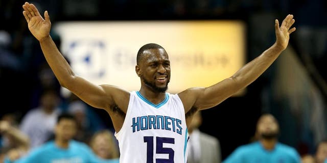 CHARLOTTE, NC - APRIL 25: Kemba Walker #15 of the Charlotte Hornets reacts to the crowd against the Miami Heat during game four of the Eastern Conference Quarterfinals of the 2016 NBA Playoffs at Time Warner Cable Arena on April 25, 2016 in Charlotte, North Carolina. NOTE TO USER: User expressly acknowledges and agrees that, by downloading and or using this photograph, User is consenting to the terms and conditions of the Getty Images License Agreement. (Photo by Streeter Lecka/Getty Images)