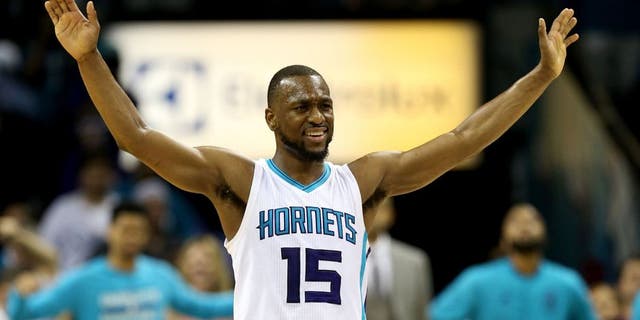 CHARLOTTE, NC - APRIL 25: Kemba Walker #15 of the Charlotte Hornets reacts to the crowd against the Miami Heat during game four of the Eastern Conference Quarterfinals of the 2016 NBA Playoffs at Time Warner Cable Arena on April 25, 2016 in Charlotte, North Carolina. NOTE TO USER: User expressly acknowledges and agrees that, by downloading and or using this photograph, User is consenting to the terms and conditions of the Getty Images License Agreement. (Photo by Streeter Lecka/Getty Images)