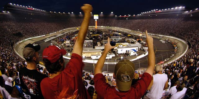 BRISTOL, TN - AUGUST 27: Fans react to a pass by Dale Earnhardt Jr., driver of the #8 Budweiser Chevrolet, during the NASCAR Nextel Cup Series Sharpie 500 on August 27, 2005 at the Bristol Motor Speedway in Bristol, Tennessee. (Photo by Rusty Jarrett/Getty Images)