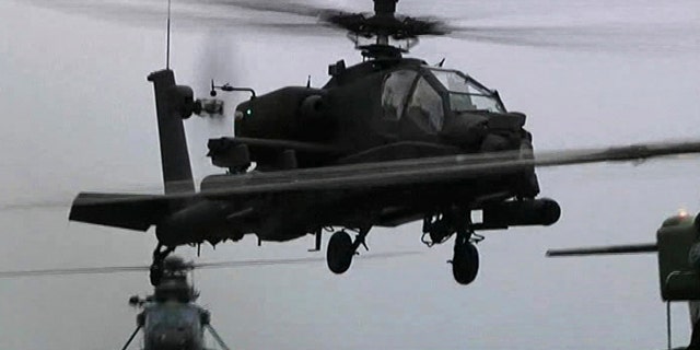 June 4: This image taken from video and made available by the British Ministry of Defense, MOD, shows a British Apache helicopter taking off from the deck of the HMS Ocean in the Mediterranean Sea, off Libya.