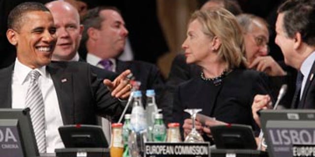 Saturday: Secretary of State Hillary Clinton and President Obama at the Afghanistan Opening Session at the NATO Summit in Lisbon, Portugal.
