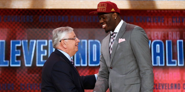 NBA Commissioner David Stern, left, shakes hands with UNLV's Anthony Bennett, who was selected first overall by the Cleveland Cavaliers in the NBA basketball draft, Thursday, June 27, 2013, in New York. (AP Photo/Jason DeCrow)