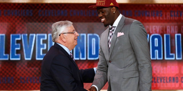 NBA Commissioner David Stern, left, shakes hands with UNLV's Anthony Bennett, who was selected first overall by the Cleveland Cavaliers in the NBA basketball draft, Thursday, June 27, 2013, in New York. (AP Photo/Jason DeCrow)