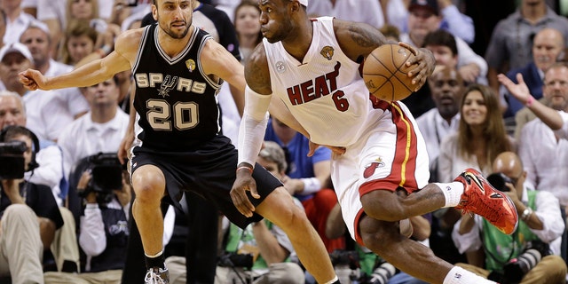 Miami Heat small forward LeBron James (6) moves the ball against San Antonio Spurs shooting guard Manu Ginobili (20) during the second half of Game 6 of the NBA Finals basketball game, Tuesday, June 18, 2013 in Miami. (AP Photo/Lynne Sladky)