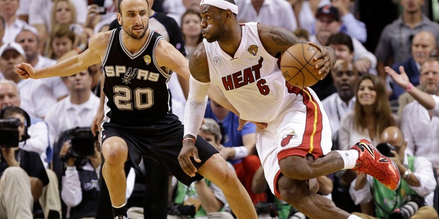 Miami Heat small forward LeBron James (6) moves the ball against San Antonio Spurs shooting guard Manu Ginobili (20) during the second half of Game 6 of the NBA Finals basketball game, Tuesday, June 18, 2013 in Miami. (AP Photo/Lynne Sladky)