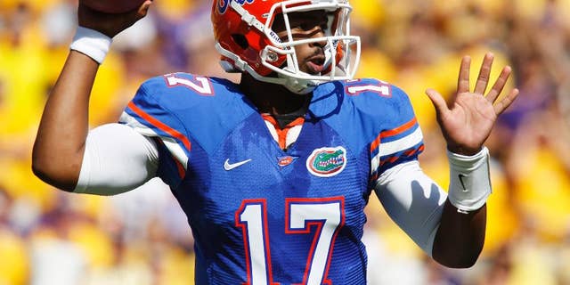 FILE - In this Oct. 8, 2011 file photo, Florida quarterback Jacoby Brissett (17) throws a pass in the first half of an NCAA college football game against LSU in Baton Rouge, La. Brissett knows he will face big expectations when he finally takes a snap for North Carolina State. Brissett, who has two years of eligibility remaining, takes over a team that won three games and went winless in the Atlantic Coast Conference for the first time since 1959. (AP Photo/Jonathan Bachman, File)
