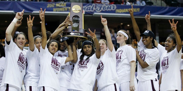 April 5: Texas A&M players celebrate with the trophy after their 76-70 win over Notre Dame in the women's NCAA Final Four college basketball championship game in Indianapolis.