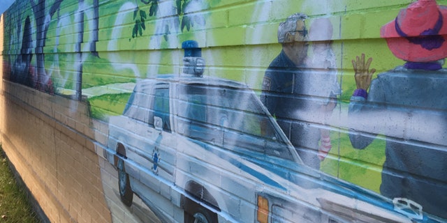 This photo shows the defaced mural on an exterior wall at the new police headquarters in Garner, N.C.