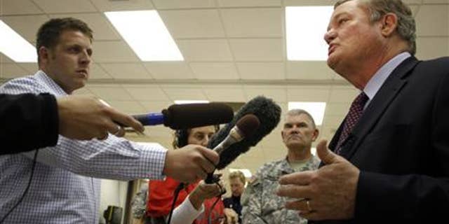 North Dakota Governor Jack Dalrymple (R) speaks with the media at the FEMA Disaster Recovery Center in Minot, North Dakota, June 27, 2011. REUTERS/Allen Fredrickson
