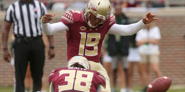 FILE - In this Sept. 12, 2015, file photo, Florida State's Roberto Aguayo kicks an extra point from the hold of Cason Beatty during an NCAA college football game against South Florida in Tallahassee, Fla. Aguayo, who is the most accurate kicker in NCAA history, could be the first kicker in 10 years to be selected in the first three rounds of the NFL Draft. (AP Photo/Steve Cannon, File)