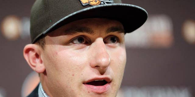 Cleveland Browns quarterback Johnny Manziel answers questions at his introductory news conference at the NFL football team's facility in Berea, Ohio, Friday, May 9, 2014. The Browns selected Manziel with the 22nd overall pick in the first round of the NFL draft. (AP Photo/Tony Dejak)