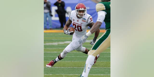 FILE - In this Dec. 21, 2013, file photo, Washington State safety Deone Bucannon (20) runs back an interception during the first half of the NCAA New Mexico Bowl college football game against Colorado State in Albuquerque, N.M. Bucannon was selected in the first round, 27th overall, by the Arizona Cardinals in the NFL draft on Thursday, May 8, 2014. (AP Photo/Matt York, File)