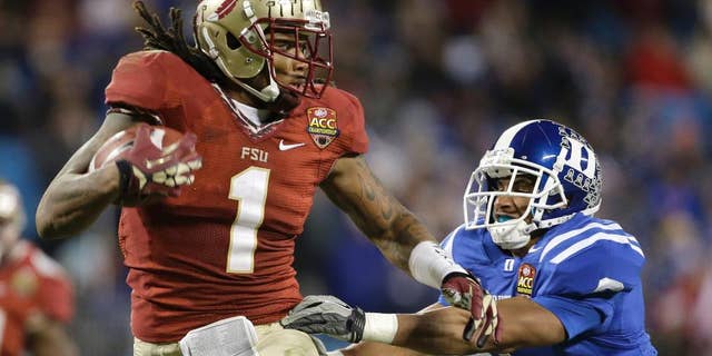 FILE - In this Dec. 7 2013, file photo, Florida State's Kelvin Benjamin (1) runs past Duke's Ross Cockrell (6) for a touchdown in the second half of the Atlantic Coast Conference Championship NCAA football game in Charlotte, N.C. Benjamin was selected in the first round, 28th overall, by the Carolina Panthers in the NFL draft on Thursday, May 8, 2014. (AP Photo/Bob Leverone, File)