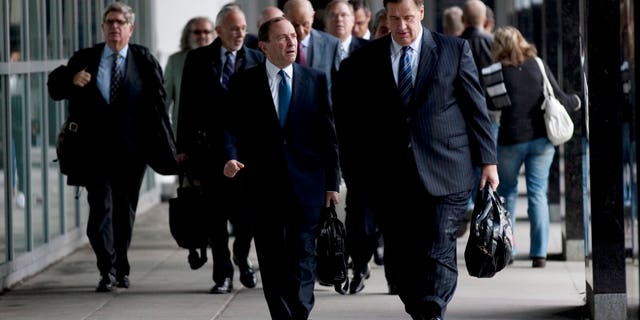 Oct. 18, 2012 File of NHL Commissioner Gary Bettman, left foreground, and Calgary Flames co-owner Murray Edwards arrive for negotiations with the Players Association in Toronto.