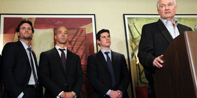Dec. 6, 2012: Winnipeg Jets' Ron Hainsey, left, Vancouver Canucks' Manny Malhotra, second from left, and Pittsburgh Penguins' Sidney Crosby, second from right, listens as Don Fehr, right, executive director for the National Hockey League Players Associations, speaks to reporters in New York.