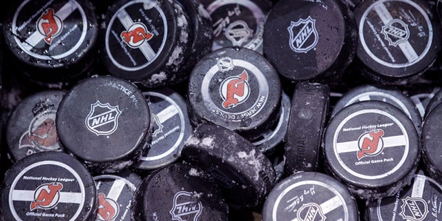 May 15, 2012: In this file photo, ice covered hockey pucks are shown at the New Jersey Devils practice rink in Newark, N.J.