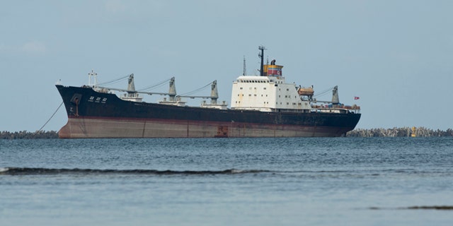 FILE - In this Nov. 27, 2013 file photo, the North Korean-flagged cargo ship Chong Chon Gang sits in Sherman Bay near Colon City, Panama. Panama Canal officials say on Saturday, Feb. 8, 2014 that the seized ship is free to leave because the owner has paid a fine. Three of the ship's operators still face charges, while 32 crew members are free to return to North Korea. The vessel was detained in July 2013 when a search revealed it was carrying weapons from Cuba. (AP Photo/Arnulfo Franco, File)