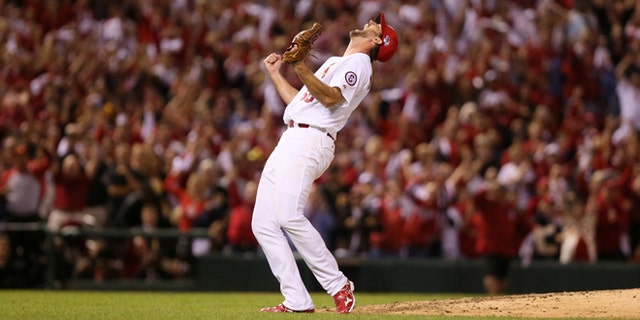 St. Louis Cardinals starting pitcher Adam Wainwright reacts after throwing a complete game shut out during Game 5 of the National League Division Series between the St. Louis Cardinals and the Pittsburgh Pirates on Wednesday, Oct. 9, 2013, at Busch Stadium in St. Louis. (AP Photo/post-dispatch.com, Chris Lee)