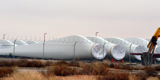 Blades for wind turbines sit in a field in the New Mexico town of Santa Teresa along the U.S.-Mexico border.