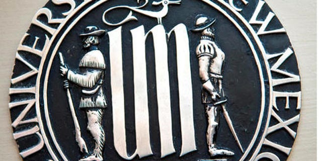 This undated photo shows the University of New Mexico's official seal, depicting a Spanish conquistador and a frontiersman, that is drawing accusations of racism from Native American students. New Mexico's largest university is considering revising its half-century old seal over concerns by Native American students who say it represents the frontier's violent era. (Marla Brose/Albuquerque Journal via AP
