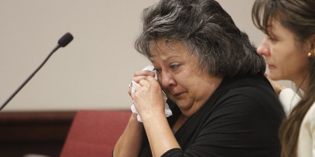 Former New Mexico Secretary of State Dianna Duran wipes away tears during her sentencing at Judge T. Glenn Ellington's district courtroom in Santa Fe, N.M., Monday, Dec. 14, 2015. Duran was sentenced to 30 days in jail for siphoning money from her election account to fuel a gambling addiction in a case that has led to calls for an overhaul of the stateâs campaign finance and ethics laws (Luis Sanchez Saturno/Santa Fe New Mexican via AP) MANDATORY CREDIT