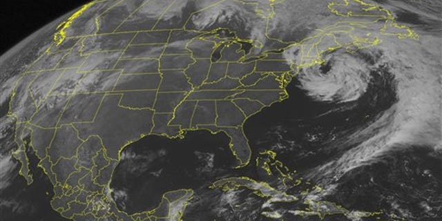 March 31, 2010: This NOAA satellite image shows mid-level clouds swirling over the Northeast and curving into the western Atlantic Ocean as a weakening low pressure system remains off the New England coast.