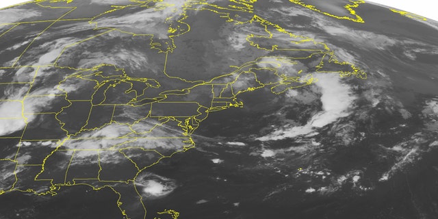 This NOAA satellite image taken Monday, Aug. 18, 2014 at 01:45 AM EDT shows a storm off the shore of northern New England that is extending a cold front into the Carolinas.