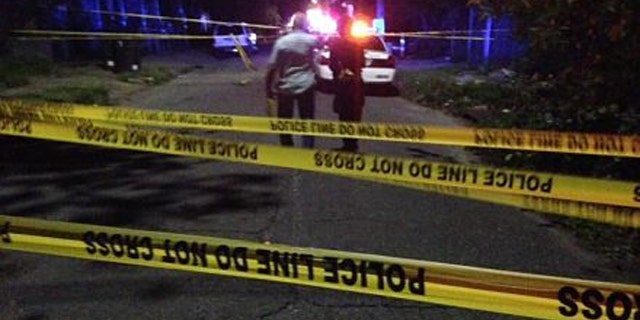 August 10, 2014: New Orleans police investigate a shooting in the city's Lower Ninth Ward that left two people dead and five others injured, including two young children. (Courtesy WVUE-TV)