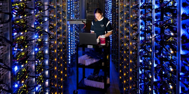 In this undated photo made available by Google, Denise Harwood diagnoses an overheated computer processor at Googleâs data center in The Dalles, Ore. Google uses these data centers to store email, photos, video, calendar entries and other information shared by its users. These centers also process the hundreds of millions of searches that Internet users make on Google each day. (AP Photo/Google, Connie Zhou)