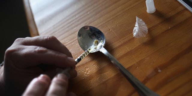 NEW LONDON, CT - MARCH 23: A heroin user prepares to inject himself on March 23, 2016 in New London, CT. Communities nationwide are struggling with the unprecidented heroin and opioid pain pill epidemic. On March 15, the U.S. Centers for Disease Control (CDC), announced guidelines for doctors to reduce the amount of opioid painkillers prescribed nationwide, in an effort to curb the epidemic. The CDC estimates that most new heroin addicts first became hooked on prescription pain medication before graduating to heroin, which is stronger and cheaper. (Photo by John Moore/Getty Images)