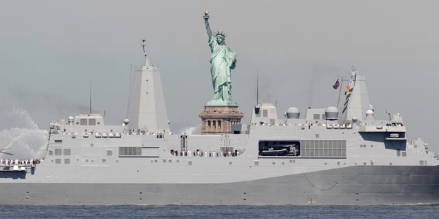 Sailors stand on the deck as the USS New York passes the Statue of Liberty to kick off Fleet Week in New York, Wednesday, May 25, 2011. Fleet Week ends on Memorial Day with a military flyover honoring American military personnel who lost their lives in service.