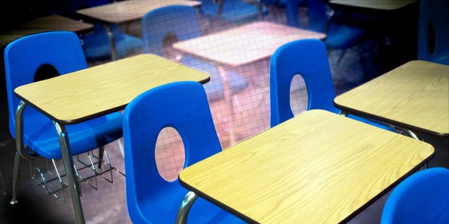 Classroom desks used at Decker College await auction Friday, Feb. 10, 2006 at the site of the former school in Louisville, Ky. Decker, a for-profit trade school run by former Massachusetts Gov. William Weld, is now closed, mired in bankruptcy proceedings and under FBI investigation in a case that has cast a long shadow over Weld's bid to become the next governor of New York. (AP Photo/Brian Bohannon)