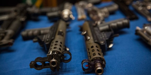 NEW YORK, NY - AUGUST 19: Guns seized by the New York Police Department (NYPD), in the largest seizure of illegal guns in the city's history, are displayed on a table during a press conference on August 19, 2013 in New York City. The operation, which involved an undercover agent buying guns that were smuggled from North Carolina and South Carolina, yielded over 250 guns. ninteen people have been charged in the operation. (Photo by Andrew Burton/Getty Images)