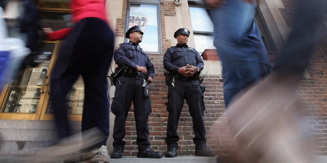 NEW YORK, NY - MARCH 20: New York Police Department officers keep watch outside the 92nd Street Y, a Jewish institution, in Manhattan on March 20, 2012 in New York City. Extra security has been added to Jewish sites around the city following the attack on a Jewish school in France that killed four people. (Photo by Mario Tama/Getty Images)