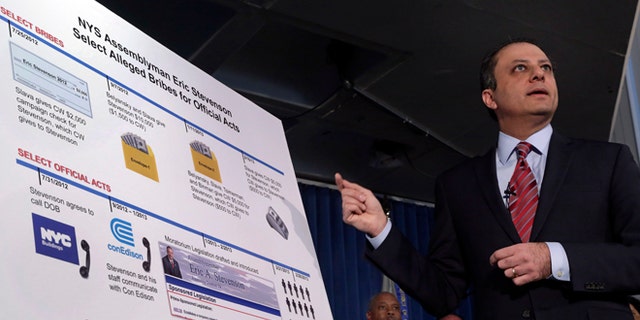 U.S. Attorney Preet Bharara gestures to a chart during a news conference in New York, Thursday, April 4, 2013. New York state Assemblyman Eric Stevenson, a Democrat, was arrested in a bribery investigation that also led another state assemblyman charged with crimes.