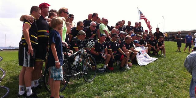New York firefighters who biked to the Pentagon for Sunday's 9/11 anniversary pose for a picture. (Fox News Photo/Justin Fishel)