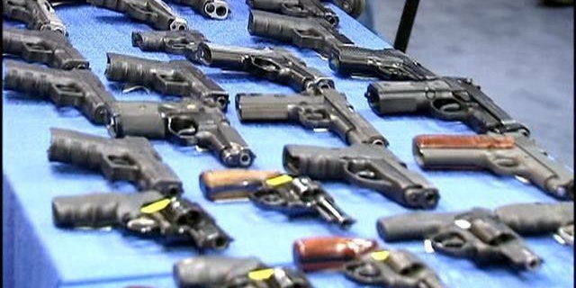 November 19, 2014: This photo shows some of the guns seized from a firearm-smuggling ring that used discount bus lines to transport weapons from Florida to New York (MyFoxNY.com)