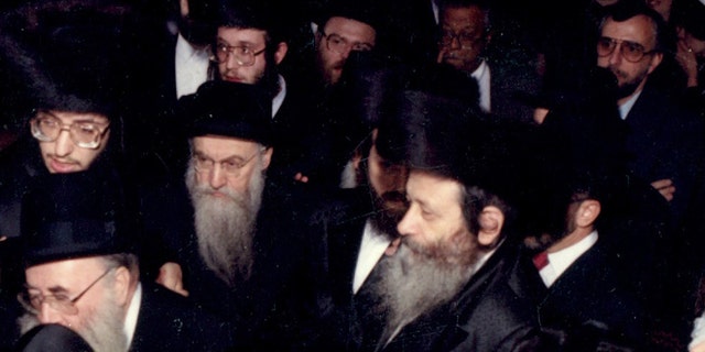 Nov. 1, 1989: In this photo provided by vosizneias.com, courtesy of Isaac Abraham, Rabbi Chaskel Werzberger, center right, attends a wedding in the Williamsburg section of the Brooklyn borough of New York.