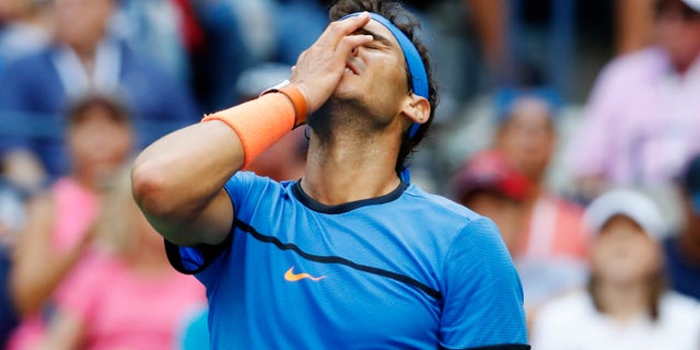 Rafael Nadal, of Spain, reacts during his match with Lucas Pouille, of France, during the fourth round of the U.S. Open tennis tournament, Sunday, Sept. 4, 2016, in New York. (AP Photo/Alex Brandon)