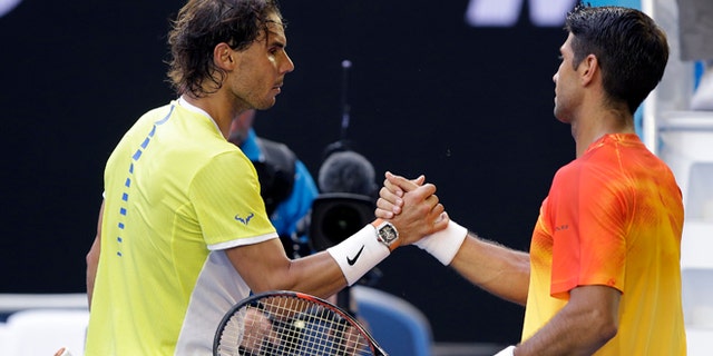Rafael Nadal, left, of Spain congratulates compatriot Fernando Verdasco after their first round match at the Australian Open tennis championships in Melbourne, Australia, Tuesday, Jan. 19, 2016.(AP Photo/Aaron Favila)