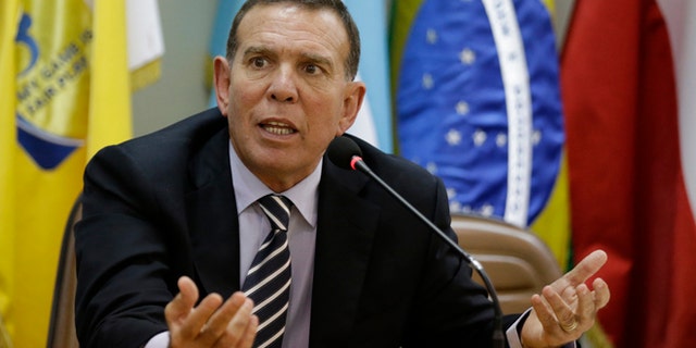 FILE - In this May 21, 2015 file photo, CONMEBOL President Juan Angel Napout talks during a press conference in Asuncion, Paraguay. Napout was arrested on Thursday, Dec. 3, 2015, in a pre-dawn raid at a luxury hotel in Switzerland as part of the U.S. Department of Justice's widening bribery case that has shaken world soccer's scandal-hit governing body, FIFA. The Swiss justice ministry says, Napout who is also a FIFA vice president, is opposing his extradition to the U.S. (AP Photo/Jorge Saenz, File)