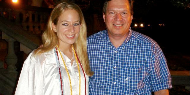 Natalee Holloway with her father Dave Holloway on her graduation day from Mountain Brook High School in Mountain Brook, Ala., in this 2005 photo.