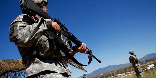 Oct. 8, 2010: National Guard troops patrol along the U.S. and Mexico border in Nogales, Ariz.